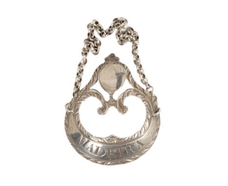 George III silver decanter label of closed gorget form, with pierced centre, feather-edge borders and vacant cartouche, surmo