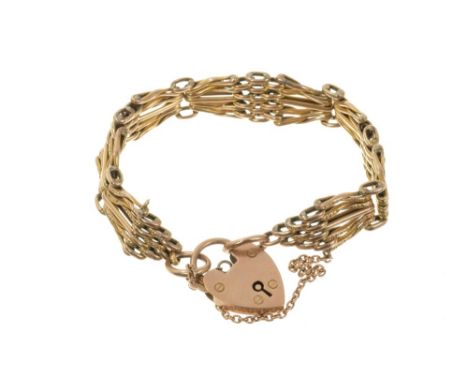 Edwardian 9ct rose gold gate bracelet with engraved scroll decoration and padlock claspCondition report: Good condition comme