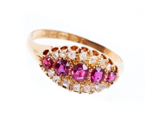 Edwardian ruby and diamond ring with a row of five graduated oval mixed cut rubies flanked by a border of old cut and rose cu