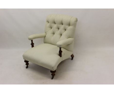 Late 19th / early 20th century walnut open armchair stamped Howard &amp; Son, with green striped button upholstery raised on 
