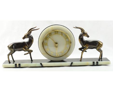 French Art Deco mantle clock, flanked by gazelles with raised legs, 61cm long.  