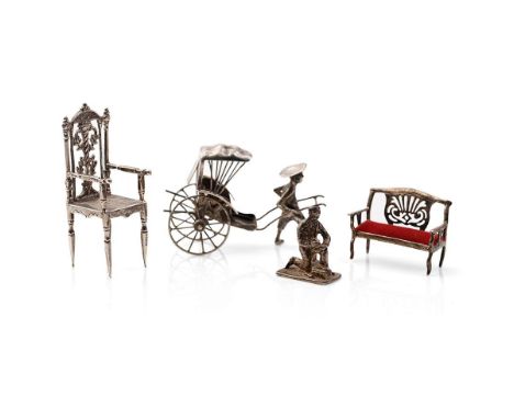 A collection of novelty silver items to include a scene of a gentleman pulling a cart, a miniatures sterling silver figure of