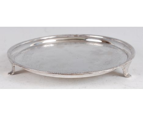 A George III silver salver, having a gadrooned raised rim within leaf and flower engraved band, 13.7oz, maker WB&B, Sheffield