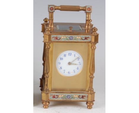A 19th century French lacquered brass and champleve enamel four pillar carriage clock, having a circular enamelled dial with 