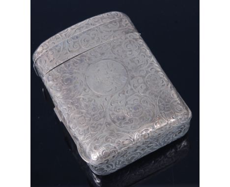 A late Victorian silver combination snuff box / vesta, of shaped rectangular form, having all-over foliate engraved decoratio