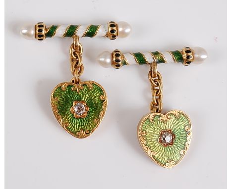 A pair of yellow metal cufflinks, each link comprising a heart shaped plate in green guilloche enamel with scrollwork border,