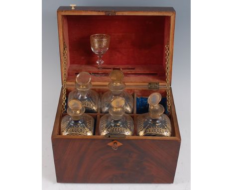 A George III mahogany decanter box, of rectangular form, the hinged dome lid revealing fitted interior for six decanters (one