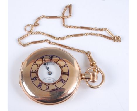 A 9ct yellow gold half hunter keyless wind 15 jewel pocket watch by Goldsmiths &amp; Silversmiths Co Ltd, the watch having a 