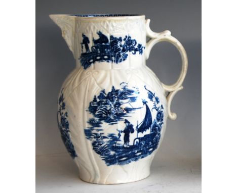 A Caughley cabbage leaf mask jug, circa 1775-90, printed in blue with the Fisherman &amp; Cormorant pattern and associated bo