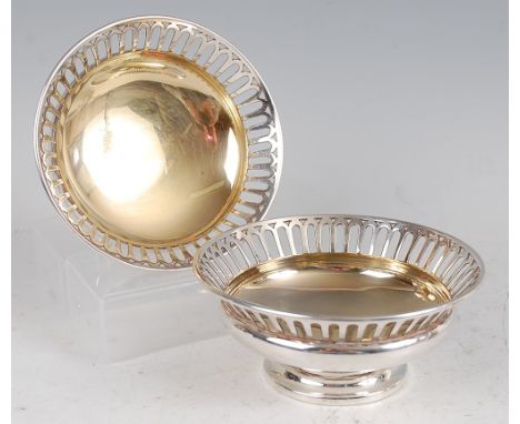 A pair of Edwardian silver bonbon dishes, each having pierced rims and gilt washed bowls, 10.6oz, maker Martin Hall &amp; Co 