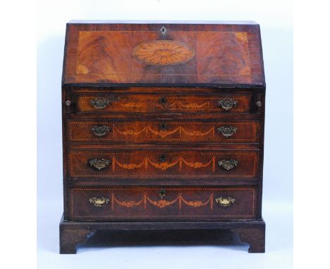 A George III mahogany and marquetry inlaid slopefront writing bureau, the sloping fall with satinwood and harewood inlays wit