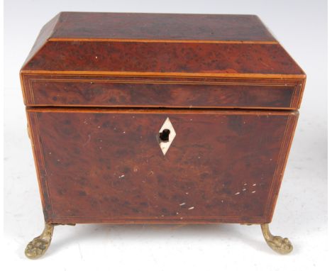 A late George III burr yew and boxwood strung tea caddy , of sarcophagus form, the hinged lid opening to reveal twin compartm