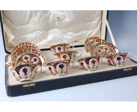 A cased set of six Royal Crown Derby teacups and saucers, decorated in the Imari palette and heightened in gilt, pattern No.1