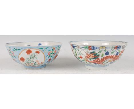 A Chinese porcelain bowl , the interior blue and white decorated with flowering rockwork and chrysanthemums, the exterior dec