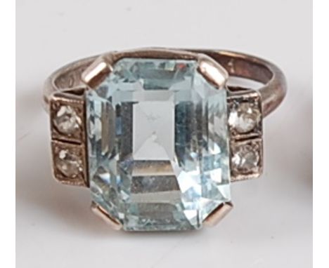 A white metal Art Deco style aquamarine and colourless spinel ring, the trap cut aquamarine measuring approx 13.5 x 10.6 x 8.