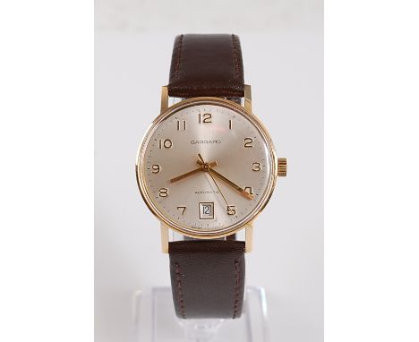 A Gents 9ct yellow gold Garrard automatic wristwatch, the watch having a round silvered Arabic dial with sweep second hand an