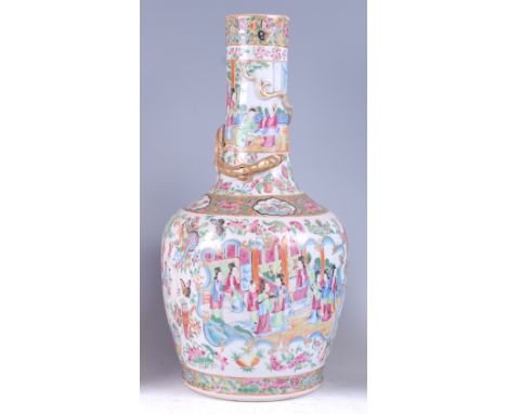 A 19th century Chinese Canton bottle vase, enamel decorated with opposing reserves of ceremonial figure scenes within borders