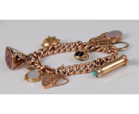 A 9ct gold curblink bracelet, containing a Georgian fob seal, bloodstone and agate set swivel fob, an agate and bloodstone se