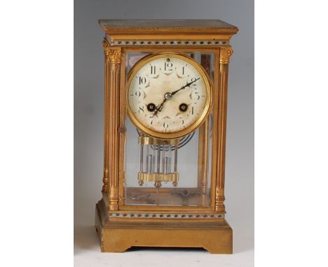 A circa 1900 French lacquered brass cased four glass mantel clock, the white enamel dial (badly discoloured) having Arabic nu