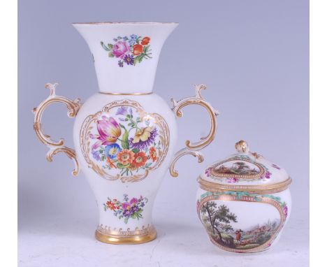 A 19th century Meissen porcelain twin handled vase, decorated in bright enamels with floral sprays within gilt borders, blue 