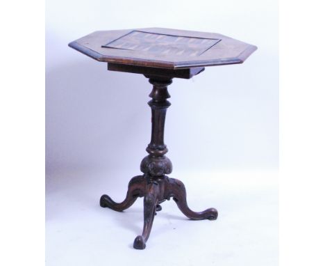 A Victorian figured walnut tripod games table, the octagonal top inset with marquetry backgammon and cribbage board, the whol