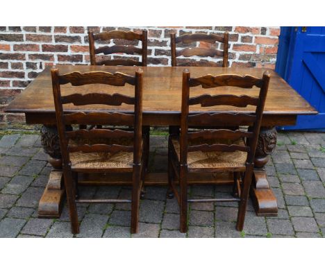 Heavily carved reproduction Jacobean refectory table in oak (168cm x 90cm Ht76cm) with 4 rush seated ladder back chairs