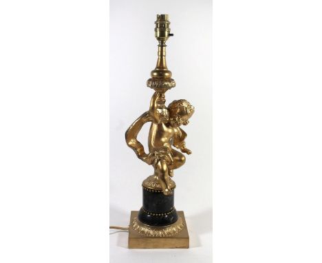 A 20th Century Spanish gilt metal and marble table lamp
The pedestal formed as a cherub,  raised on a marble column and a squ