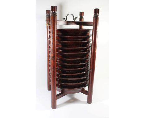 A Chinese bamboo plate stand
Containing twelve plates with rope twist edge, bears wax seal mark to one column support, height