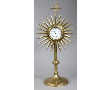 A brass church monstrance converted to a mantel clock the white enamel dial with black roman numerals &amp; signed “Swiza 8”,