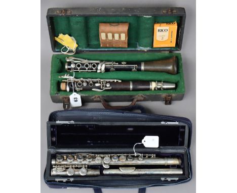 A Boosey &amp; Hawkes of London ebony clarinet with chrome fittings, 67cm long; &amp; a T-James of London chrome flute, 67cm 
