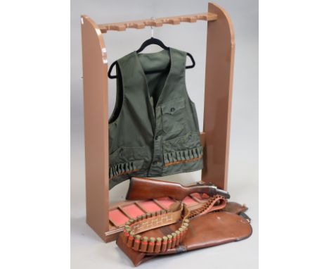 A "W. Cooey Machine & Arms Co." shotgun stock & action; two ammunition belts; a Browning soft leather gun case; a green cotto