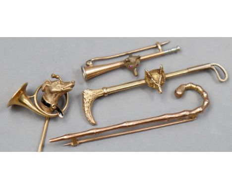 A 9ct. gold novelty “umbrella” bar-brooch; another 9ct. gold novelty bar-brooch in the form of a riding crop &amp; fox’s head