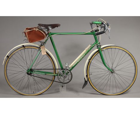 A vintage Raleigh “Reg Harris” gent’s bicycle (green) with a Brooks leather saddle.