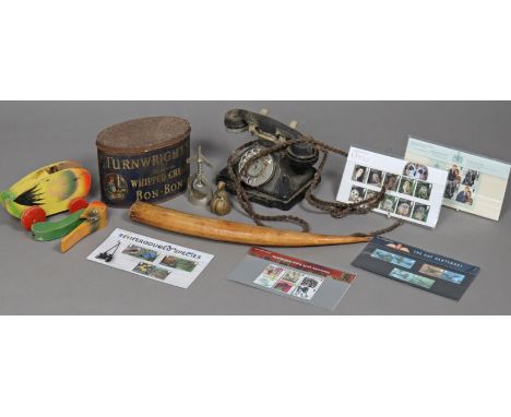 A vintage G.P.O. black bakelite pyramid telephone; a vintage Turnwright’s Delicious Whipped Cream Bon-Bons advertising tin, e