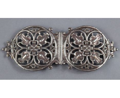 A Victorian silver nurse’s belt buckle, each cast &amp; pierced sections in the form of a gothic roundel, 6cm dia., 15.5cm ac