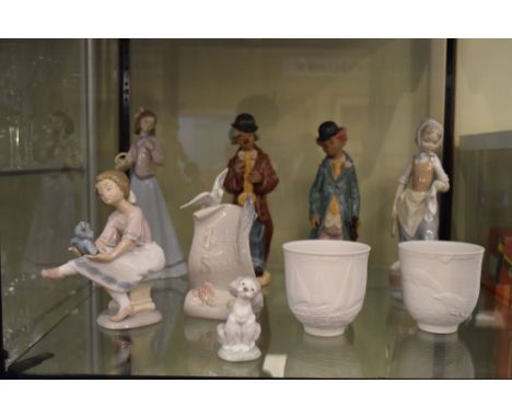 Quantity of Lladro and Nao figures and a Lladro Society scroll ornament  