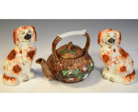 Majolica tree trunk and floral decorated teapot, 18cm high, together with a pair of Staffordshire dogs, 19cm high  