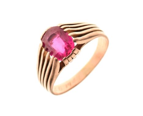 Gold coloured metal dress ring set large ruby coloured stone, the shank dated 1943, size V  