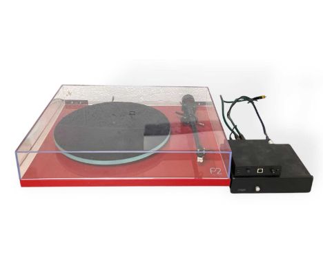 A Rega Planar 2 (P2) turntable in red with a Rega RB220 tonearm and a Rega Carbon cartridge (powers on and spins). Also inclu