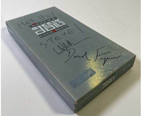 A copy of the Steely Dan 'Citizen' CD boxset (MCAD 4-10981) signed to box by Water Becker and Donald Fagen with inscription '