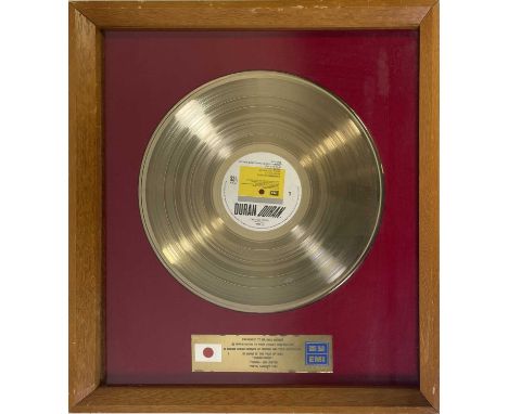 An original 1984 gold disc award presented to Mike Berrow in recognition of the success of the self titled Duran Duran LP in 