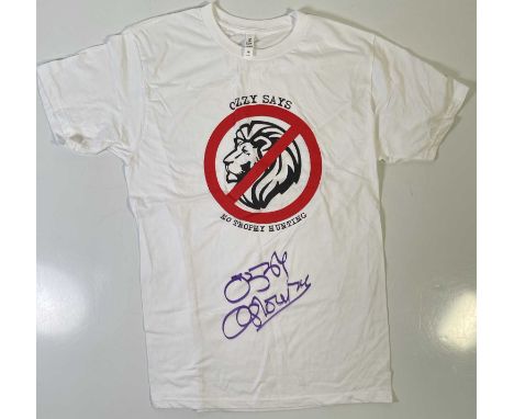 An original t-shirt (M) designed by Ozzy Osbourne, signed in black marker pen by Ozzy Osbourne. Provenance: donated by Ozzy a