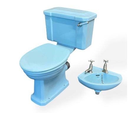A toilet and sink combination in Manchester City sky blue - formerly owned (and surely used) by Noel Gallagher at his famous 