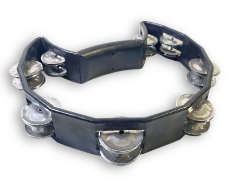A black handheld tambourine, used onstage by Liam Gallagher during Oasis concerts c late 2000s. Obtained in person by the ven