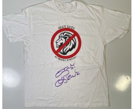 An original t-shirt (XL) designed by Ozzy Osbourne, signed in black marker pen by Ozzy Osbourne. Provenance: donated by Ozzy 