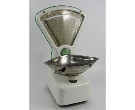 A set of Avery white enamel imperial scales, with green trim, 53cm high.