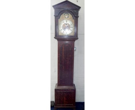 A George III oak longcase clock, with arched and pillared hood, full length trunk door and bracket feet, the 30cm square dial