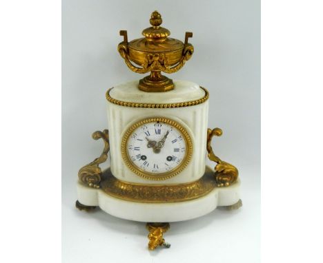 A late 19thC French white marble and gilt metal mantel clock, with Neo Classical urn pediment, and eight day movement strikin