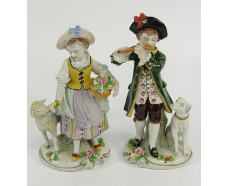 A pair of Sitzendorf porcelain figures, of an eighteenth century boy playing a flute with a hound, and a girl with a sheep, e