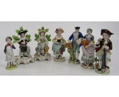 A group of Sitzendorf porcelain and other figures, comprising a pair of figure with caged birds, shepherd and shepherdess, pa